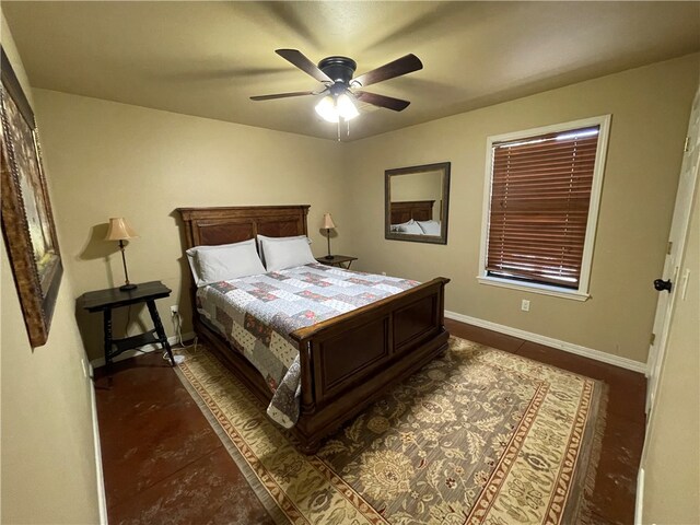 bedroom featuring ceiling fan and dark tile patterned floors