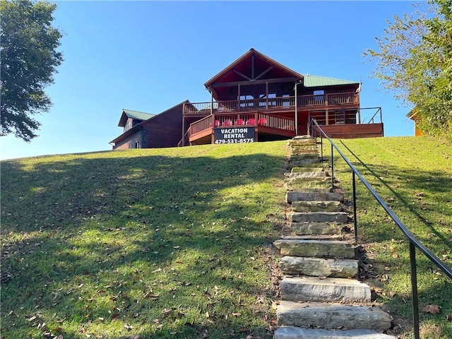 471 Mcphearson Ter, Calico Rock, AR 72519 - rear view of house featuring metal roof, stairs, and a lawn