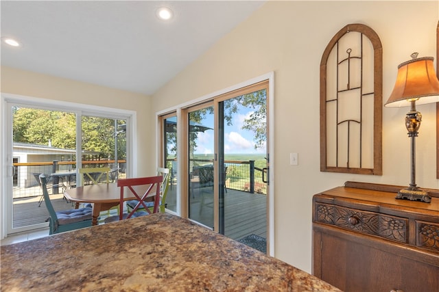 dining room featuring lofted ceiling