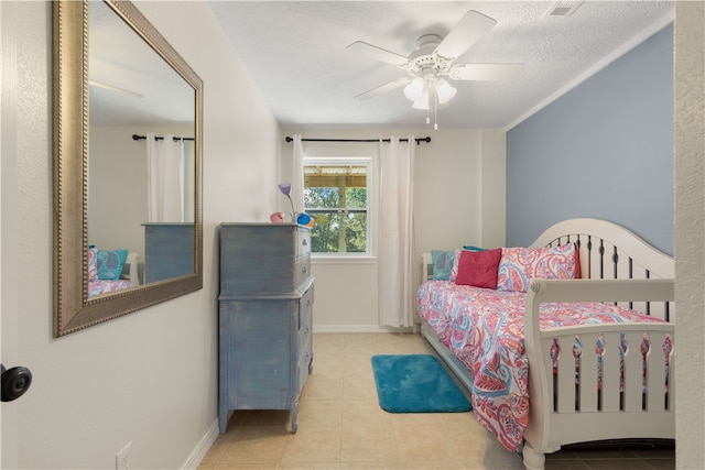 bedroom with light tile patterned floors, a textured ceiling, and ceiling fan