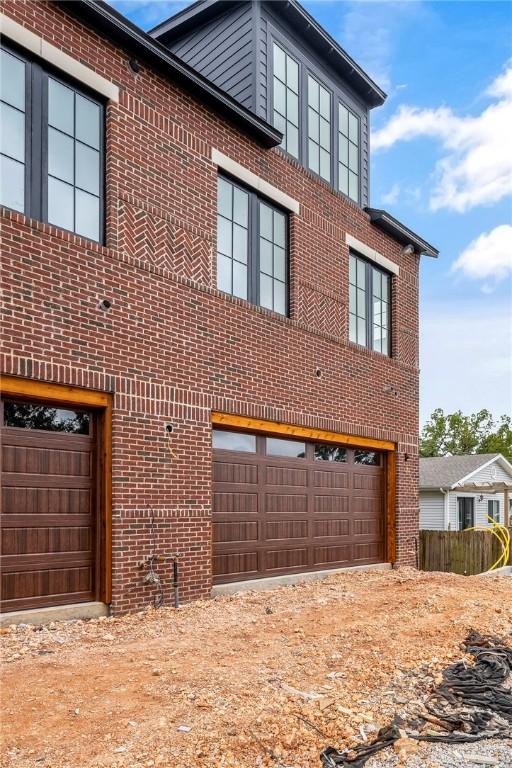 view of side of home with a garage