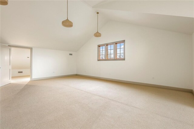 additional living space with carpet and lofted ceiling