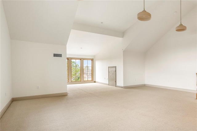 empty room featuring high vaulted ceiling and light carpet