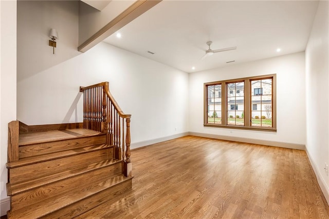 interior space with ceiling fan and hardwood / wood-style floors