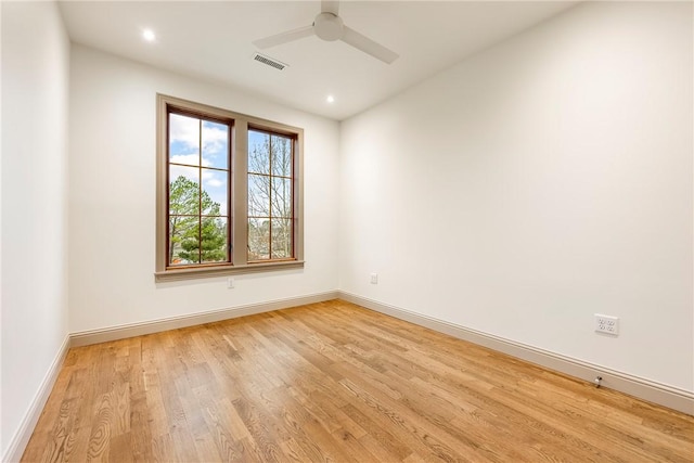 empty room with light hardwood / wood-style flooring and ceiling fan