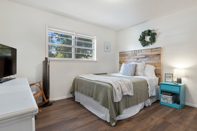 bedroom featuring dark hardwood / wood-style floors