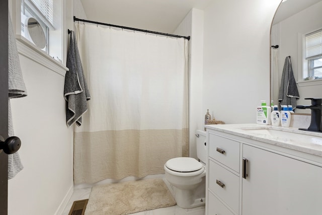 bathroom featuring toilet, tile patterned flooring, vanity, and a shower with shower curtain