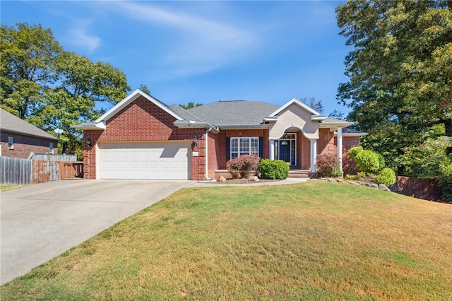 ranch-style home featuring a front lawn and a garage