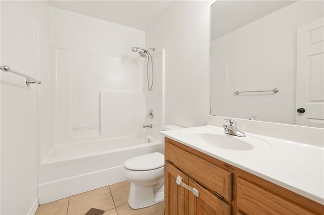 full bathroom featuring tile patterned flooring, vanity,  shower combination, and toilet