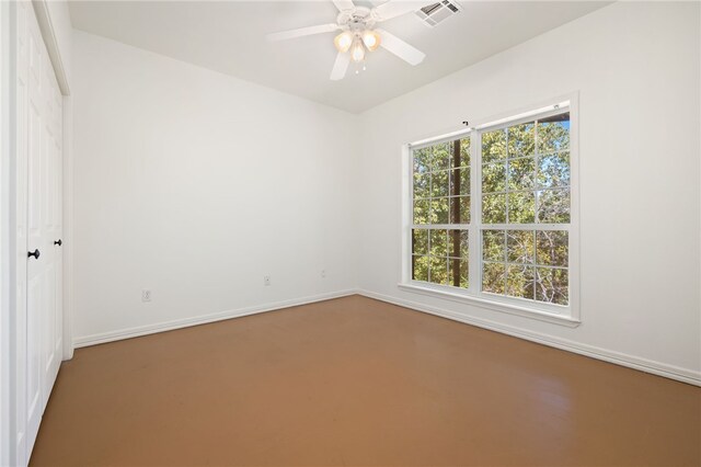 unfurnished room with ceiling fan