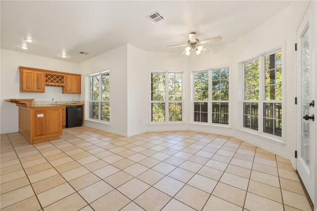 kitchen with dishwasher, light tile patterned flooring, a healthy amount of sunlight, and ceiling fan