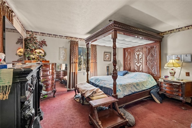 carpeted bedroom featuring a textured ceiling