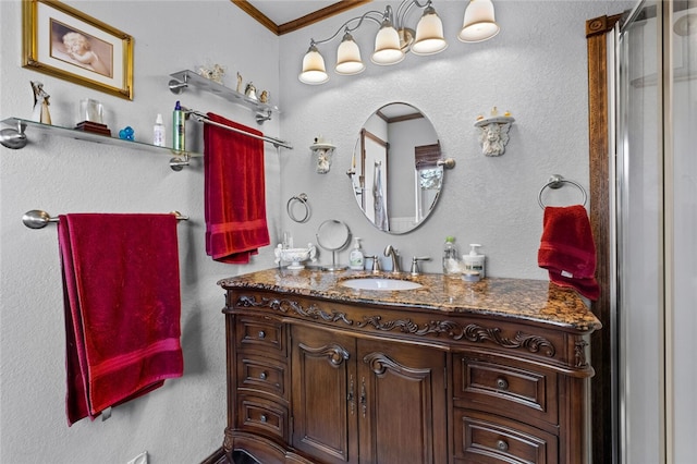 bathroom with ornamental molding and vanity