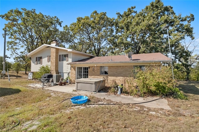 rear view of house with a patio area