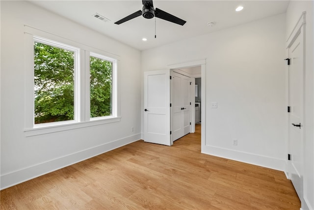 unfurnished bedroom featuring light hardwood / wood-style flooring and ceiling fan