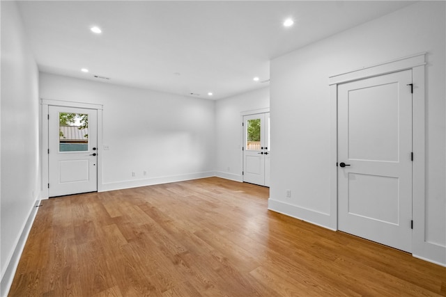 spare room featuring light wood-type flooring