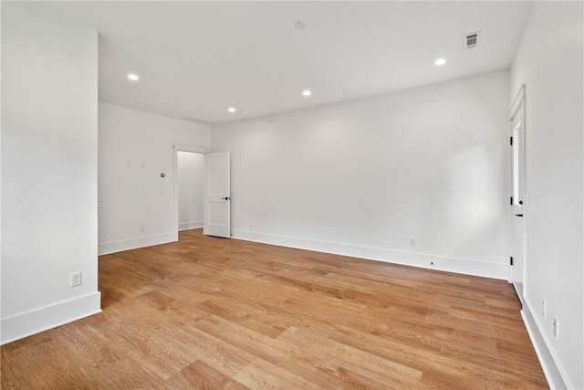 spare room with light wood-type flooring