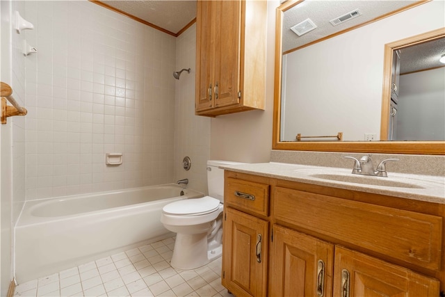 full bathroom featuring tiled shower / bath, vanity, a textured ceiling, tile patterned floors, and toilet