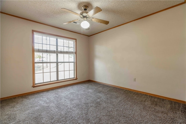 carpeted spare room with ornamental molding, ceiling fan, and a textured ceiling