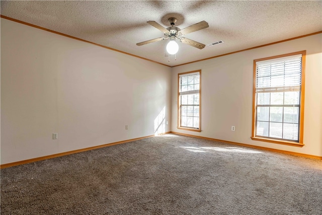 spare room with carpet flooring, ceiling fan, crown molding, and a textured ceiling