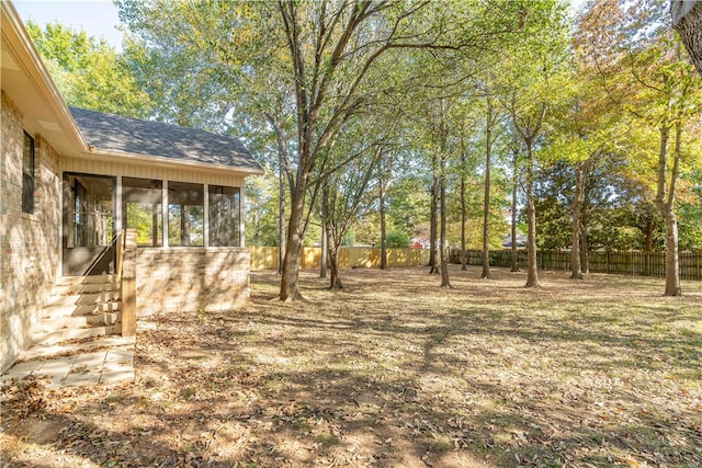 view of yard featuring a sunroom