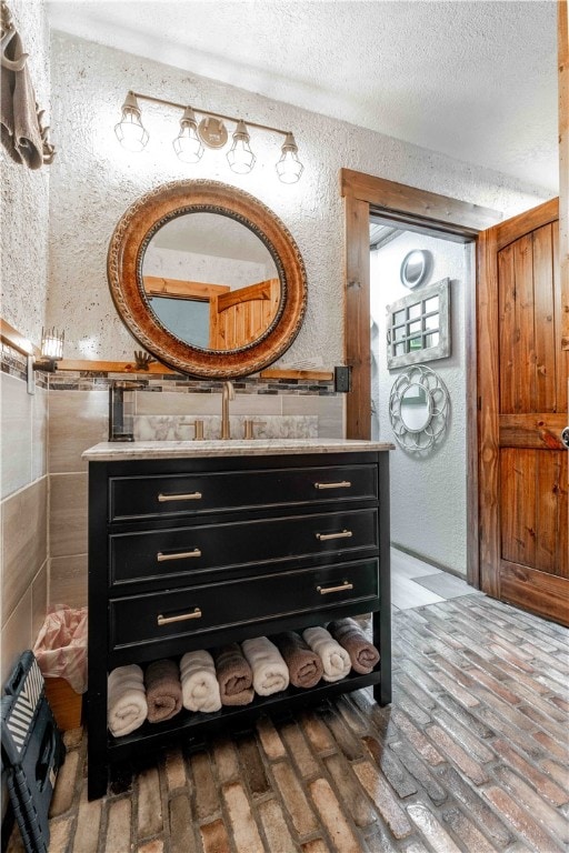 bathroom featuring vanity and a textured ceiling