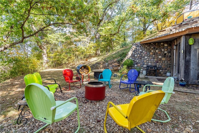 view of patio / terrace with a fire pit