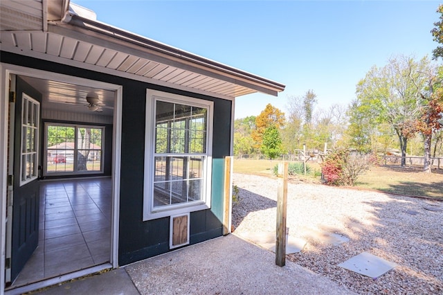 exterior space featuring ceiling fan