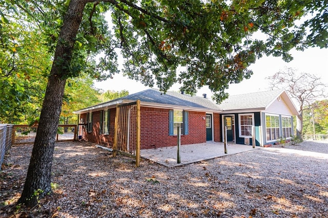 view of front of home featuring a patio and a sunroom