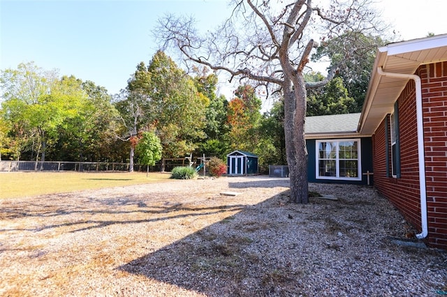 view of yard with a storage shed