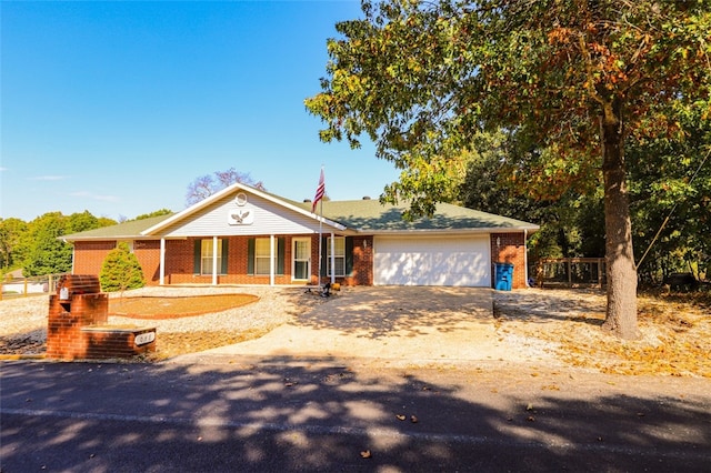 view of front facade featuring a garage and covered porch