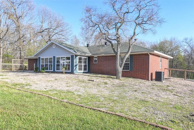 1 Hartlepool Dr, Bella Vista, AR 72715 - back of property with a sunroom, a yard, fence, cooling unit, and brick siding