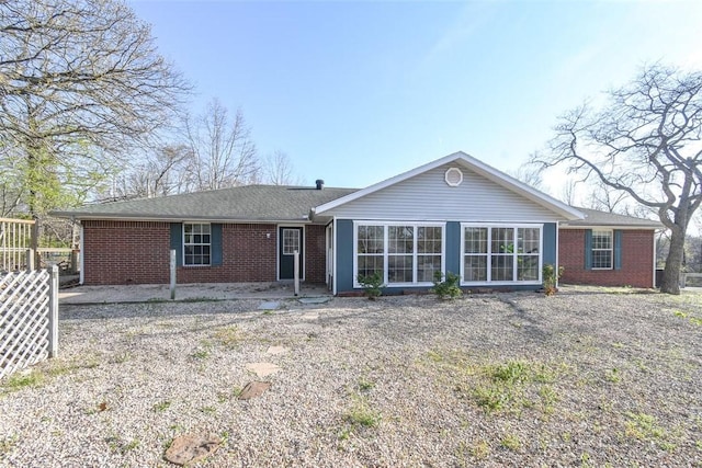 1 Hartlepool Dr, Bella Vista, AR 72715 - rear view of property featuring brick siding and fence