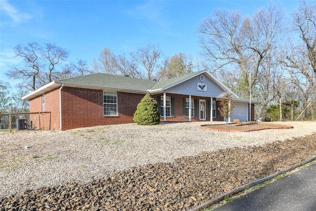 1 Hartlepool Dr, Bella Vista, AR 72715 - ranch-style house featuring brick siding, a porch, a garage, and driveway