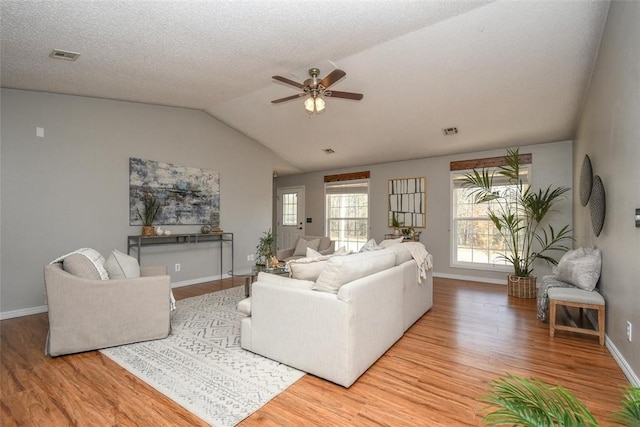 1 Hartlepool Dr, Bella Vista, AR 72715 - living area featuring wood finished floors, ceiling fan, and vaulted ceiling