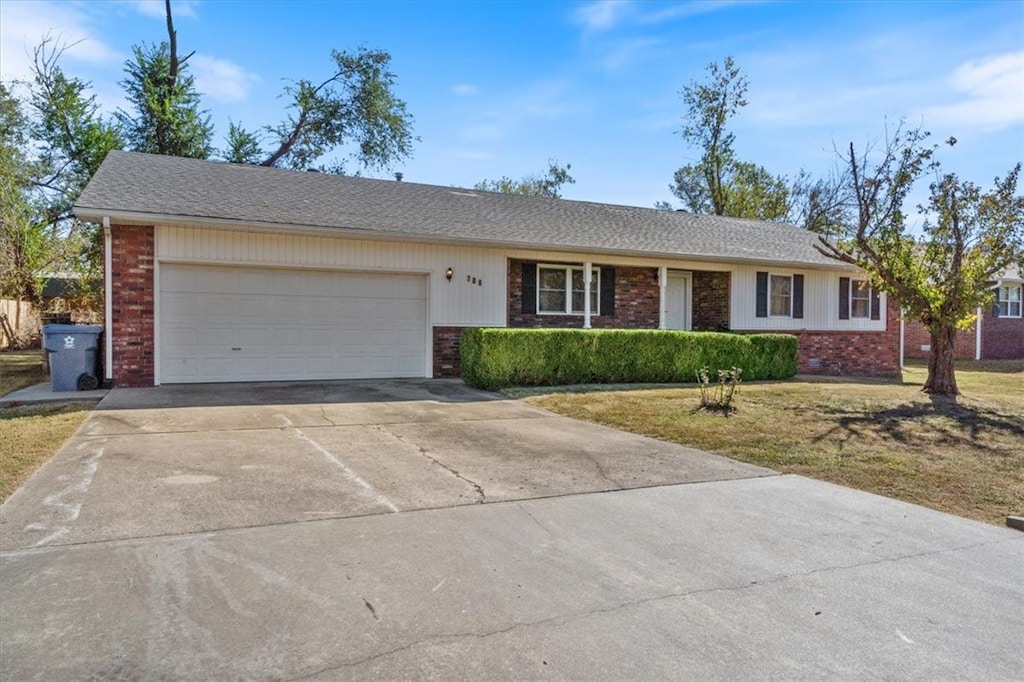 ranch-style house with a front lawn and a garage