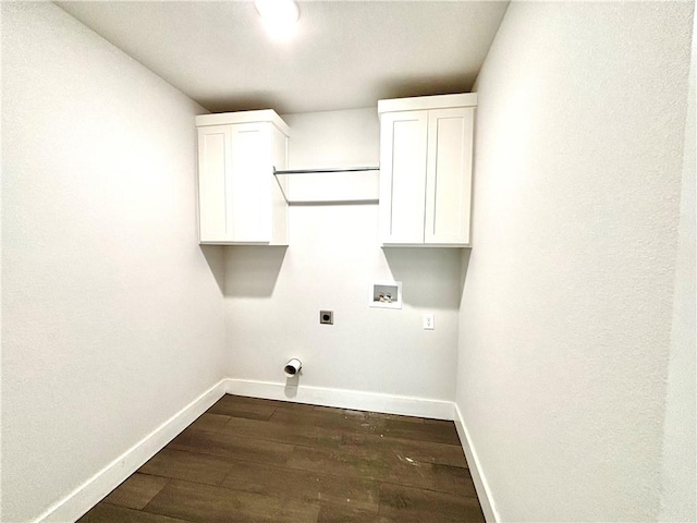 washroom featuring hookup for an electric dryer, cabinets, dark wood-type flooring, and washer hookup