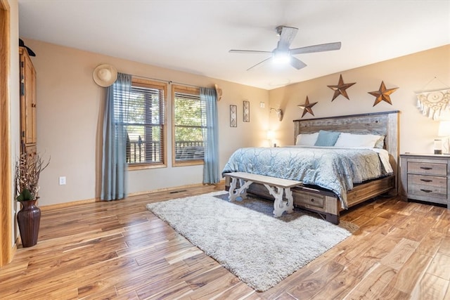 bedroom with ceiling fan and light wood-type flooring