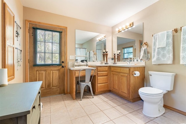 bathroom with tile patterned floors, vanity, and toilet