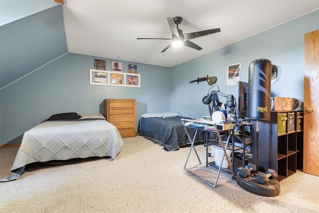 carpeted bedroom featuring lofted ceiling and ceiling fan