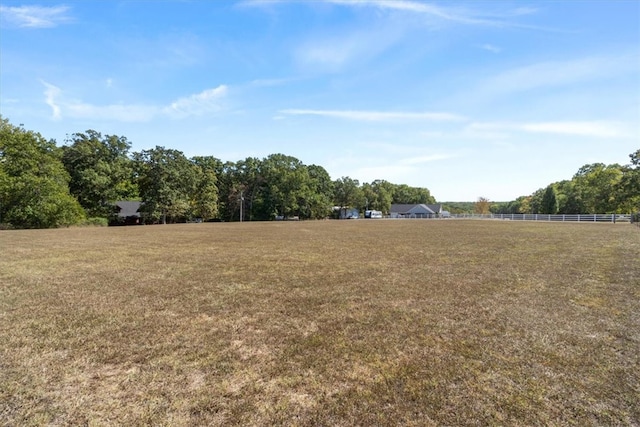 view of yard with a rural view