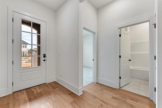 entrance foyer with light wood-type flooring