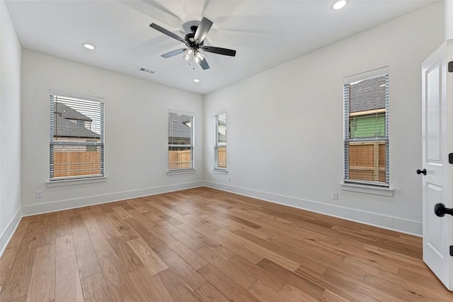 unfurnished room with ceiling fan and light hardwood / wood-style floors