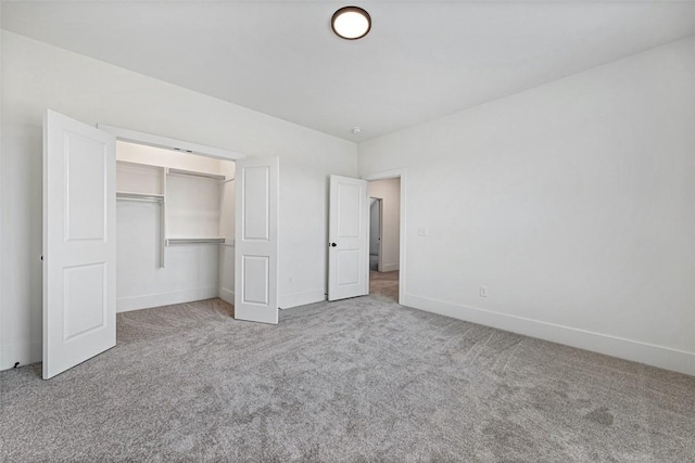 unfurnished bedroom featuring a closet and carpet