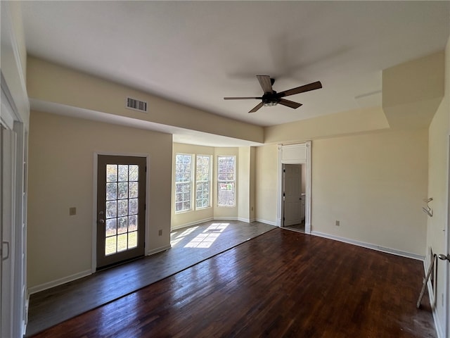 spare room featuring ceiling fan and dark hardwood / wood-style floors