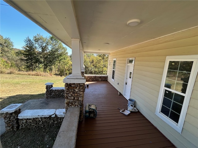 wooden deck with a yard