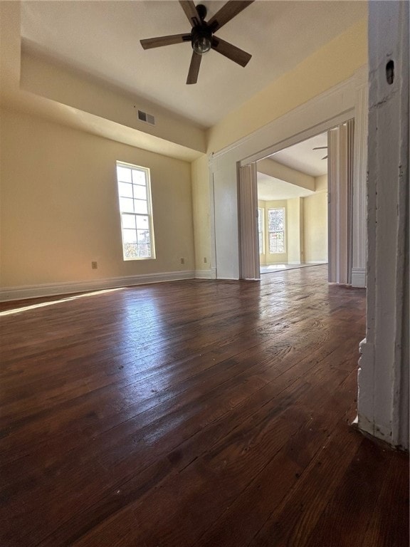 unfurnished room featuring ceiling fan and dark hardwood / wood-style flooring