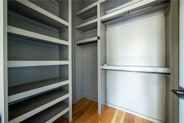 spacious closet featuring light hardwood / wood-style floors