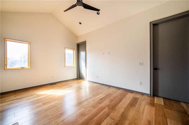 unfurnished bedroom featuring ceiling fan, high vaulted ceiling, and light hardwood / wood-style floors