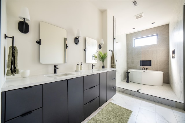 bathroom with a tub to relax in and vanity